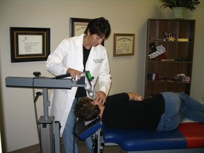 Dr. Stotts adjusting with Atlas Orthogonal 